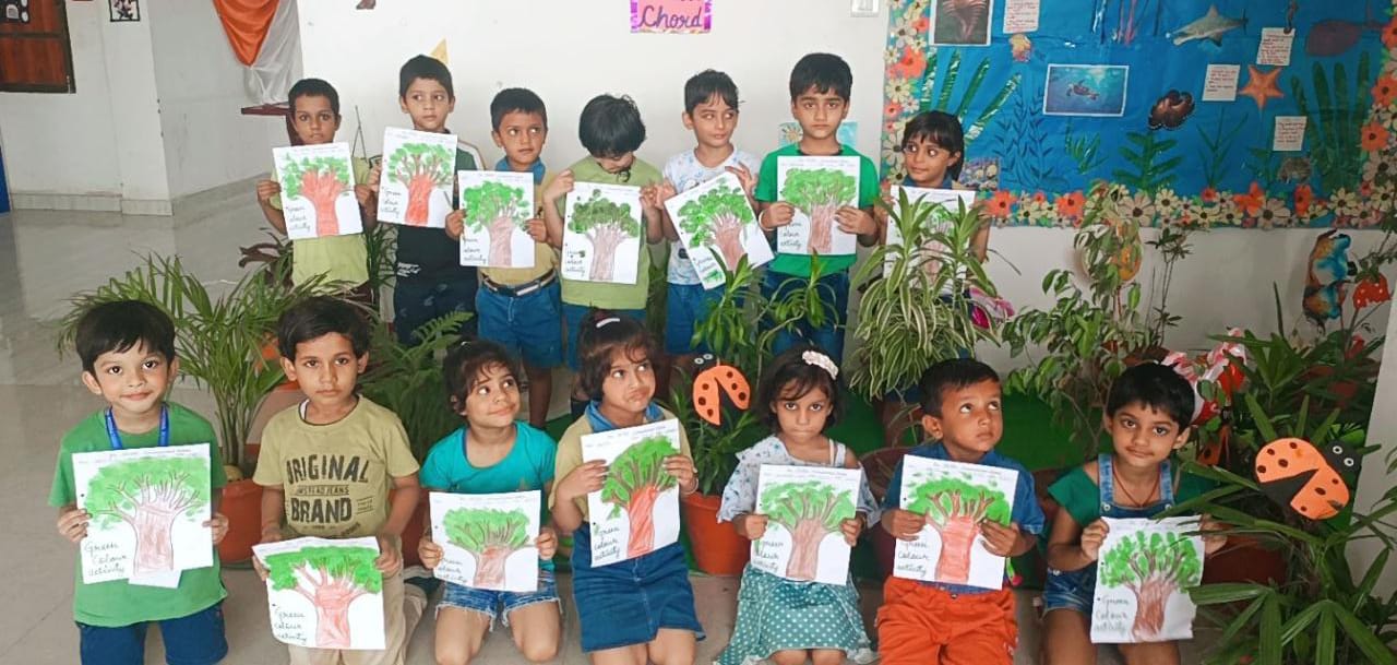 Young learners displaying their classroom work
